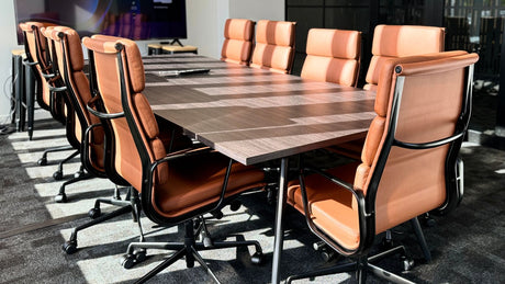 Euro meeting table with Eames Leather chairs with black frame and tan finish